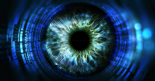 An image of a blue eye in a dark background. The eye of innovation.